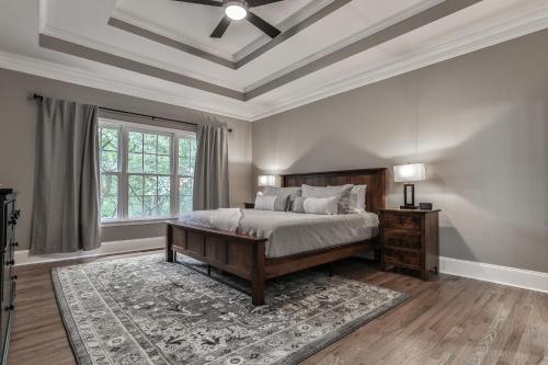 a bedroom with a bed and a coffered ceiling at Big Sky - Pet Friendly Big Canoe GA Cabin-Modern amenities, hot tub, pet friendly, mountain views, access to lakes, golf courses in Afton