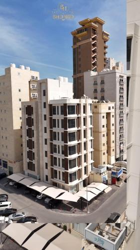 a view of a city with tall buildings at BHomed Shaab in Kuwait