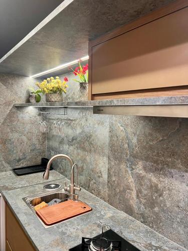 a kitchen with a sink and a counter top at View 462 Só para você! in Brasilia