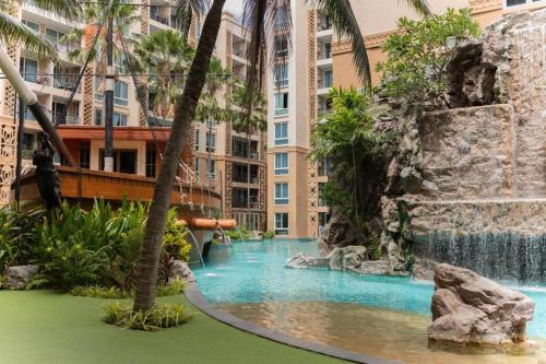 a water park in a hotel with a waterfall at Pattaya Atlantis Resort Sea View Apartments in Jomtien Beach