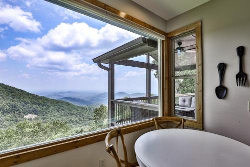 a room with a large window with a table and chairs at Southern Views in Jasper