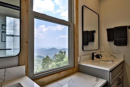 a bathroom with a large window with a view at Southern Views in Jasper