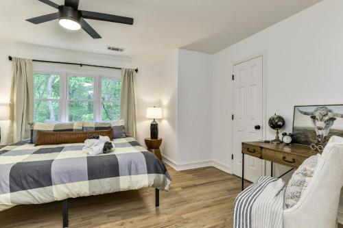 a bedroom with a bed and a ceiling fan at Robins Nest at Big Canoe - Big Canoe, GA - Enjoy Peaceful Forest Views, Rack Up a Game of Pool, and Enjoy Game Nights in the Gam in Jasper