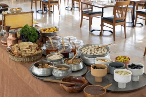 a table with many bowls of food on it at Armada Istanbul Old City Hotel in Istanbul