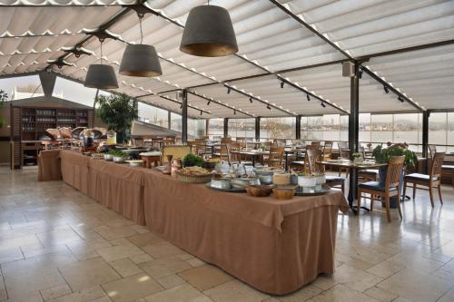a buffet line with tables and chairs in a building at Armada Istanbul Old City Hotel in Istanbul