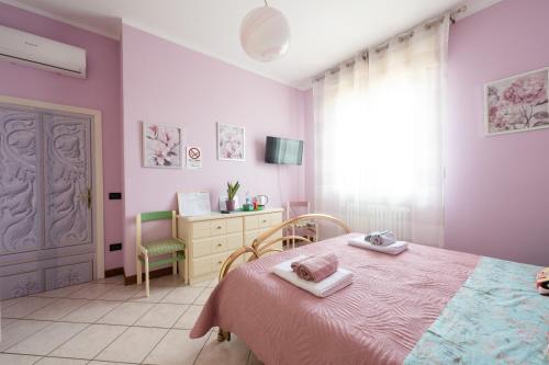 Postel nebo postele na pokoji v ubytování Alice Mercadini B&B