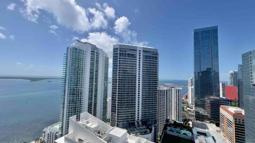 a view of a city with tall buildings and the ocean at Brickell Center w/City & Bay View + FREE Parking! in Miami