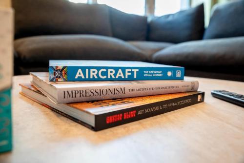 a stack of books sitting on a table at Surfside Sanctuary in South Padre Island