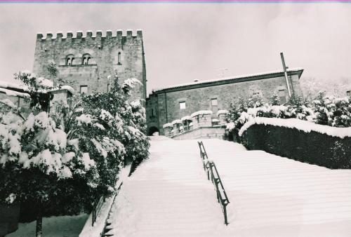 an old building with snow on the ground at Batzarki in Avellaneda
