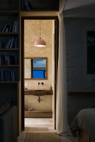 a door leading to a bathroom with a window at Cuna del Cielo in San Miguel de Allende