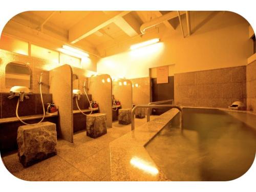 a bathroom with a large tub in a room at Hotel Brisbanes - Vacation STAY 64918v in Miyazaki