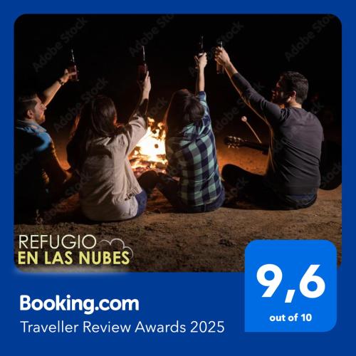 a group of people sitting around a fire at Refugio en las Nubes in Santa Elena