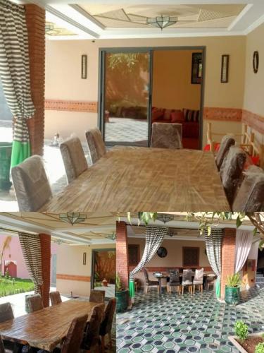 a living room with a large wooden table and chairs at House Medina Villa in Salene