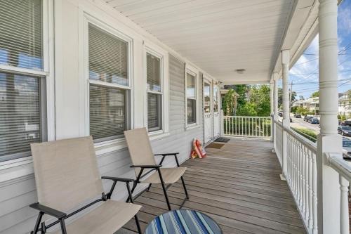 two chairs on the porch of a house at Private Cozy Room #C in Boston