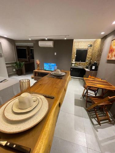 a room with a table with a hat on it at Jr flats in João Pessoa