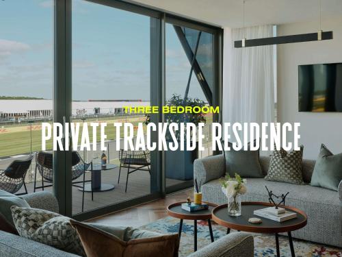 a living room with a couch and a table at Escapade Silverstone in Towcester