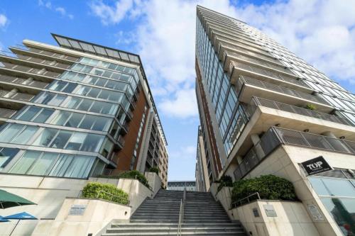 a tall building with stairs in front of it at Excel Luxury Apartment with amazing view in London