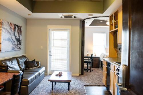 a living room with a couch and a table at Chic City Apartment with parking Canal View RoofDeck in Indianapolis