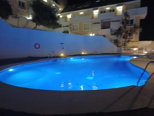 a large swimming pool in a building at night at ROYAL DUQUESA HILLS - La Duquesa, Sabinillas, Manilva, Málaga - 513 in Manilva