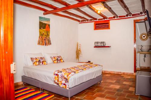 a bedroom with a bed in a room at Casa Aminta in Curití