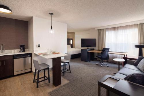 a hotel room with a living room and a hotel suite at Sonesta ES Suites Reno in Reno