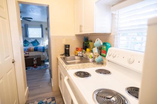 a kitchen with a sink and a stove at Hidden Gem Luxe 1 BEDROOM & Patio in Cutler Bay