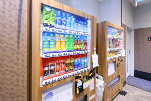 a vending machine filled with lots of drinks at Dormy Inn Matsumoto in Matsumoto