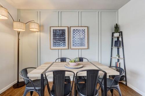 a dining room with a table and chairs at Cheerful Chalet Centrally Located w BBQ Pit in Colorado Springs