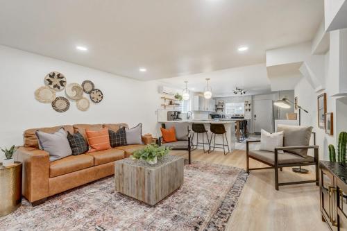 a living room with a couch and a table at Sundance Retreat 2 King Beds Downtown & Kitchen in Colorado Springs