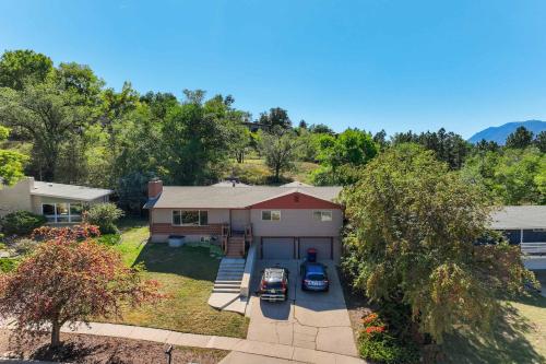 an aerial view of a house with a car parked in the driveway at Sundance Retreat 2 King Beds Downtown & Kitchen in Colorado Springs