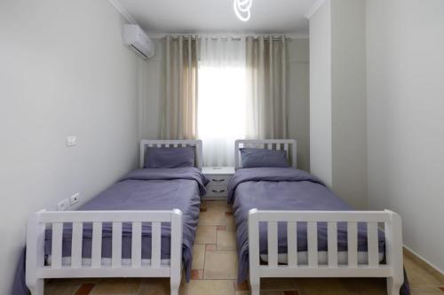 Ένα ή περισσότερα κρεβάτια σε δωμάτιο στο Sunset View Apartment Durres