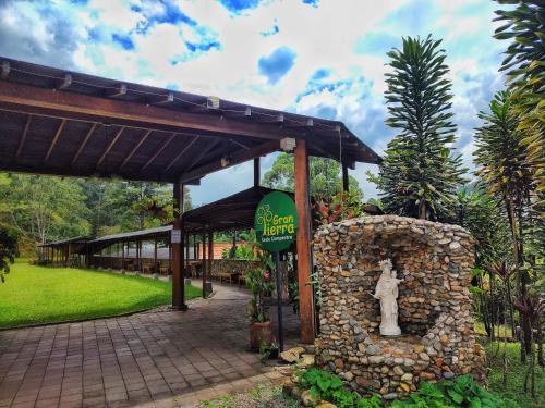 a building with a statue in front of it at Gran Tierra - Sabaneta in Medellín