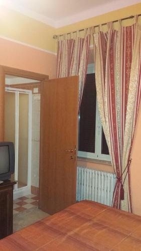 TV a/nebo společenská místnost v ubytování Pitagora B&B