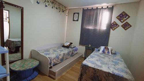 Postel nebo postele na pokoji v ubytování Casa a 5 minutos a pé da Basílica e da feira em Aparecida