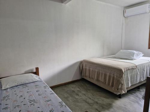 Postel nebo postele na pokoji v ubytování Pousada Mar de Mamoã