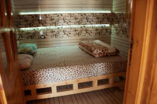 a small sauna with a bed in a room at Green Beach Camp & Hotel in Nuweiba