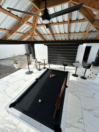 a pool table sitting on top of a patio at LEVEL suites premium in Sosúa