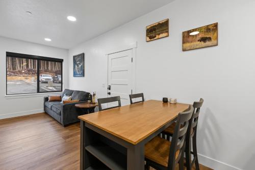 a dining room and living room with a table and chairs at Accessible, Comfort, Convenient Location 106 in Juneau