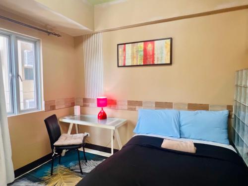 Postel nebo postele na pokoji v ubytování BGC Mckinley Center Prime Accommodations