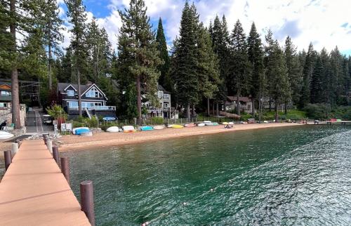 a beach with a bunch of boats on the water at Smokey Joes cabin in Zephyr Cove