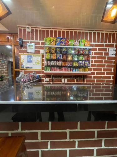 a store front of a store with a brick wall at Hotel Penthouse in Bahía Solano
