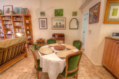 a dining room with a table and chairs and books at Sugar PIne home in Incline Village