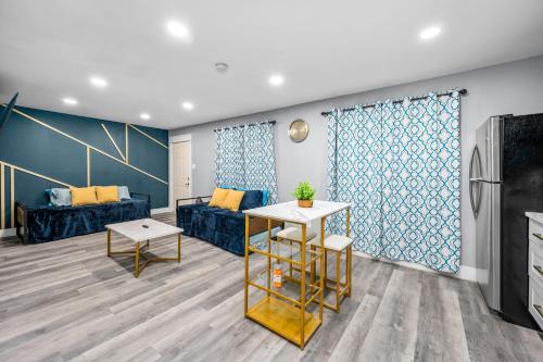 a living room with a couch and a table at Chic Heights Retreat with Pool and Free Parking in Houston