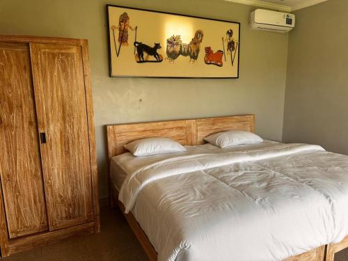 Кровать или кровати в номере Guesthouse Gelombang