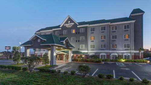 a rendering of a hotel with a parking lot at Country Inn & Suites by Radisson, St Petersburg - Clearwater, FL in Pinellas Park