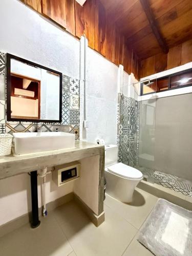 a bathroom with a sink and a toilet at Minutes away to the beach ¨Playa Blanca¨ in Paraíso