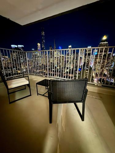 a balcony with a bench and a view of a city at Midtown High Floor Fantastic Panoramic City View Corner 2 Bedroom Apartment in New York