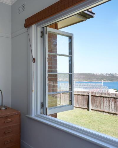 a window with a view of the ocean at Q Station in Sydney