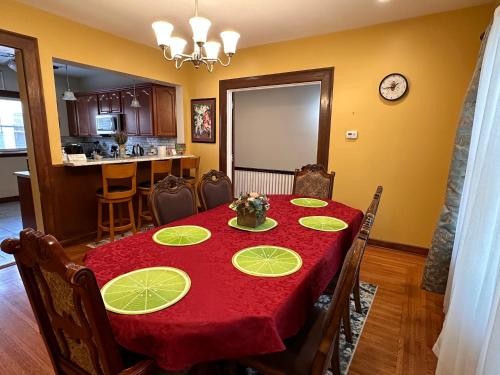 a dining room with a table with a red table cloth at Cozy Allentown Home in Buffalo