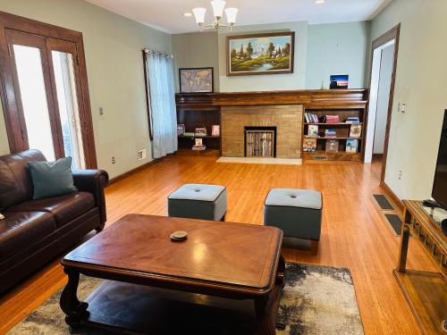 a living room with a couch and a coffee table at Cozy Allentown Home in Buffalo